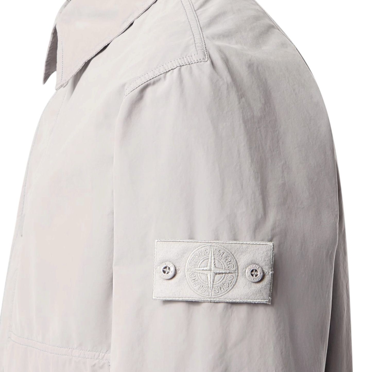Urban Saints Stone Island grey lightweight technical overshirt with iconic tonal sleeve patch and structured collar.