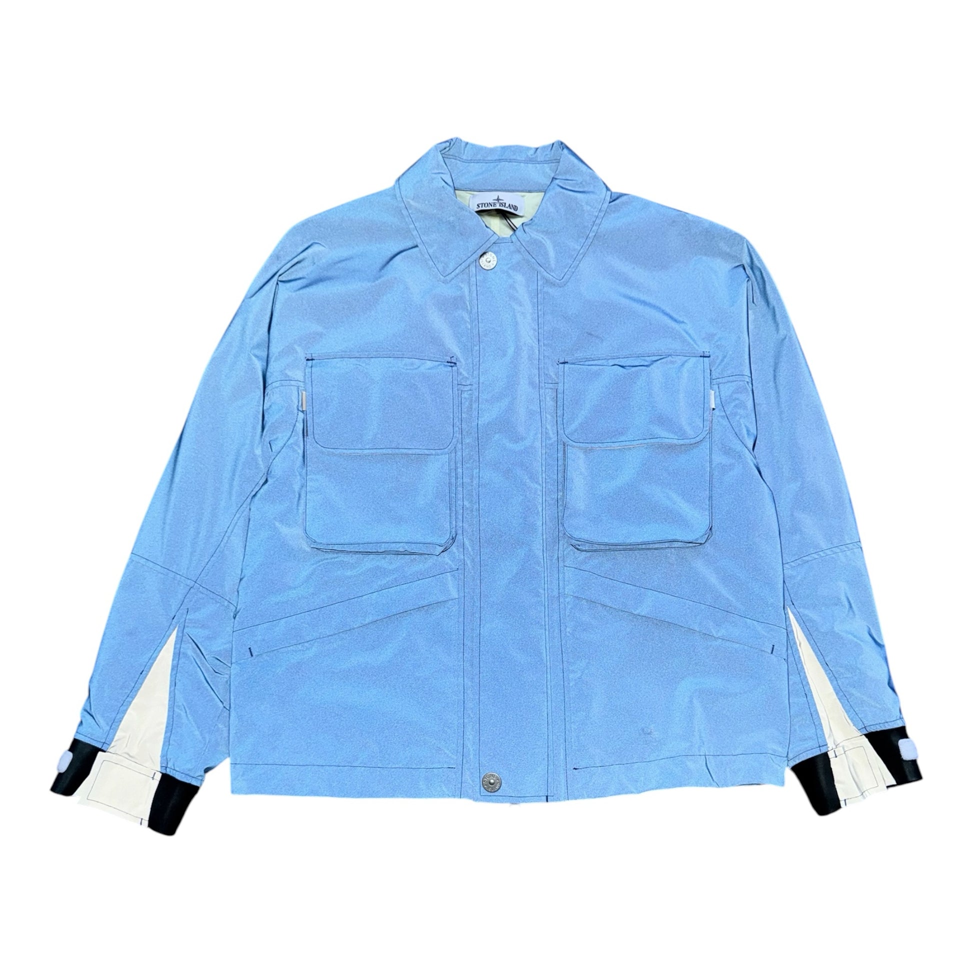 Urban Saints Stone Island Marina light blue technical utility jacket with chest pockets and adjustable cuffs.