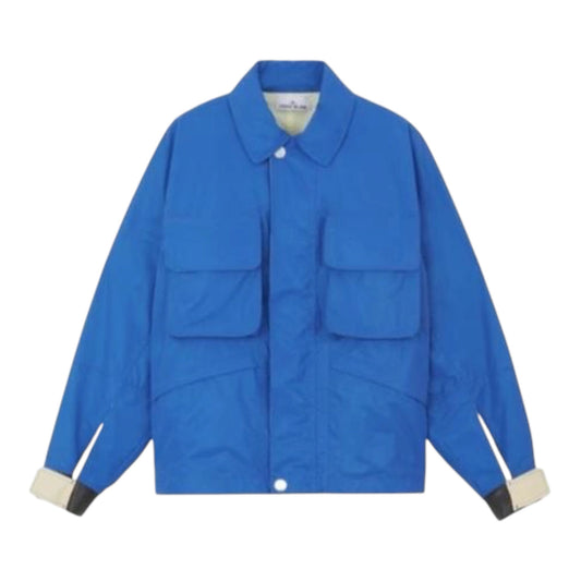 Urban Saints Stone Island Marina blue technical utility jacket with two chest pockets and contrasting cuff details.