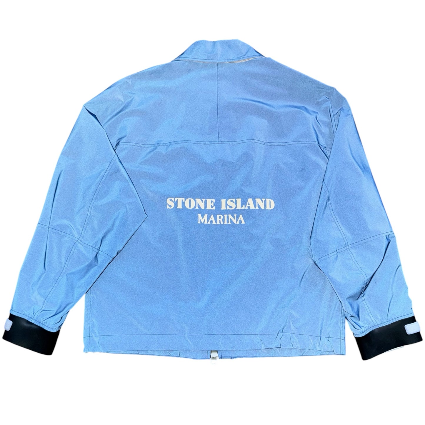Urban Saints blue Stone Island Marina utility jacket with back logo print and contrasting black adjustable cuffs.