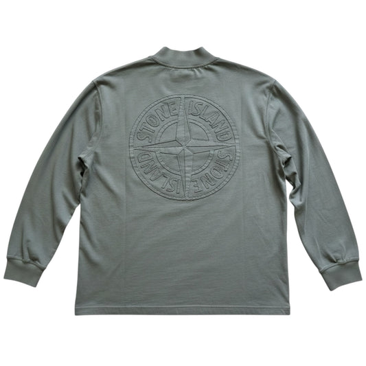 Urban Saints sage green Stone Island long sleeve mock neck top with large tonal embossed compass logo on the back.
