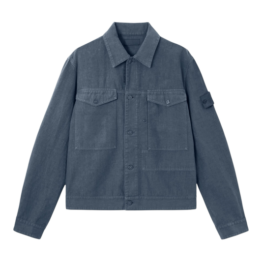 Urban Saints Stone Island blue garment-dyed utility jacket with chest pockets and signature sleeve badge.