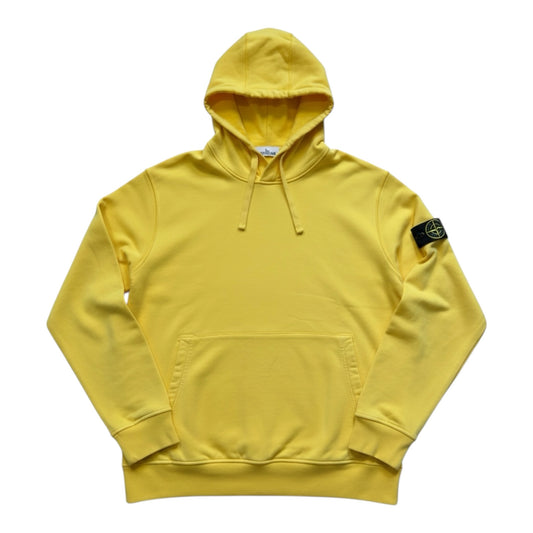 Urban Saints Stone Island yellow cotton pullover hoodie with drawstring hood, kangaroo pocket, and sleeve badge.
